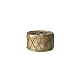 Decorative candle holder with geometric pattern on a white background