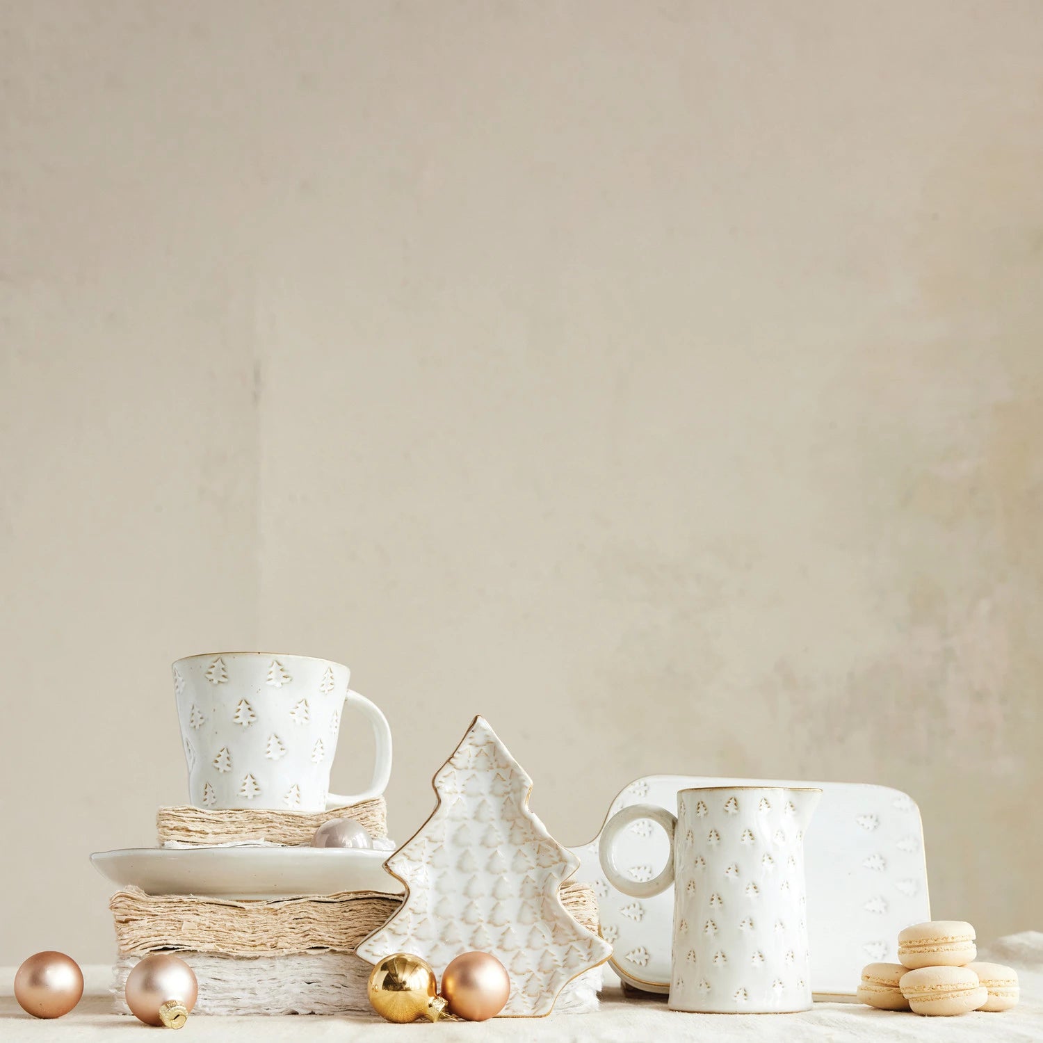 White ceramic cups and decorative items on a neutral background