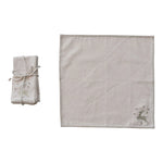 Set of linen placemats with embroidered deer design on a white background