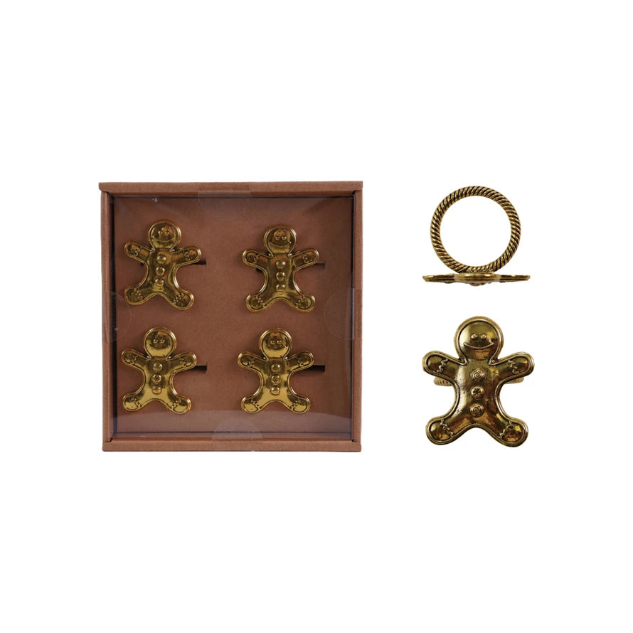 Gold gingerbread man decorations with a box on a white background