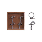 Set of silver keychains including a cross design on a white background