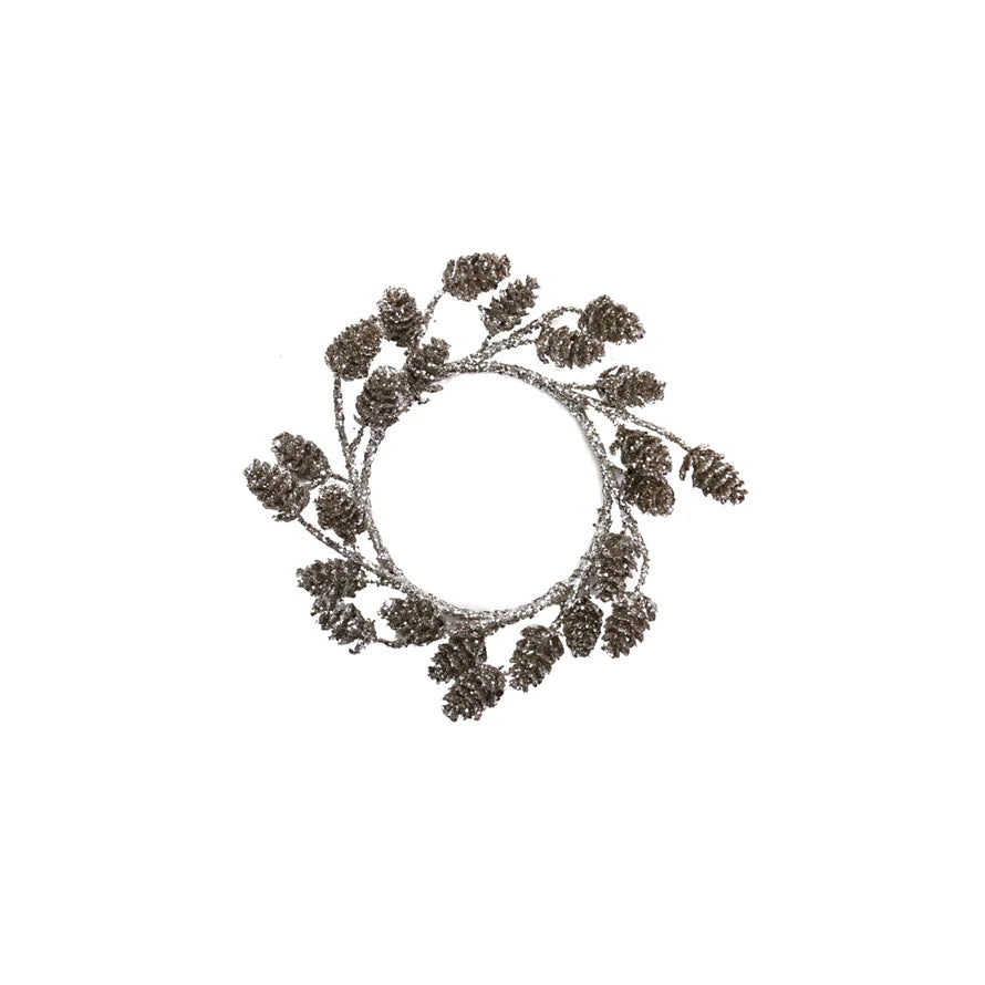 Decorative wreath with pinecones on a white background