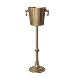 Brass wine cooler on a stand with a white background