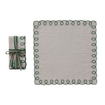 Set of folded fabric with decorative edge and a matching roll on a white background