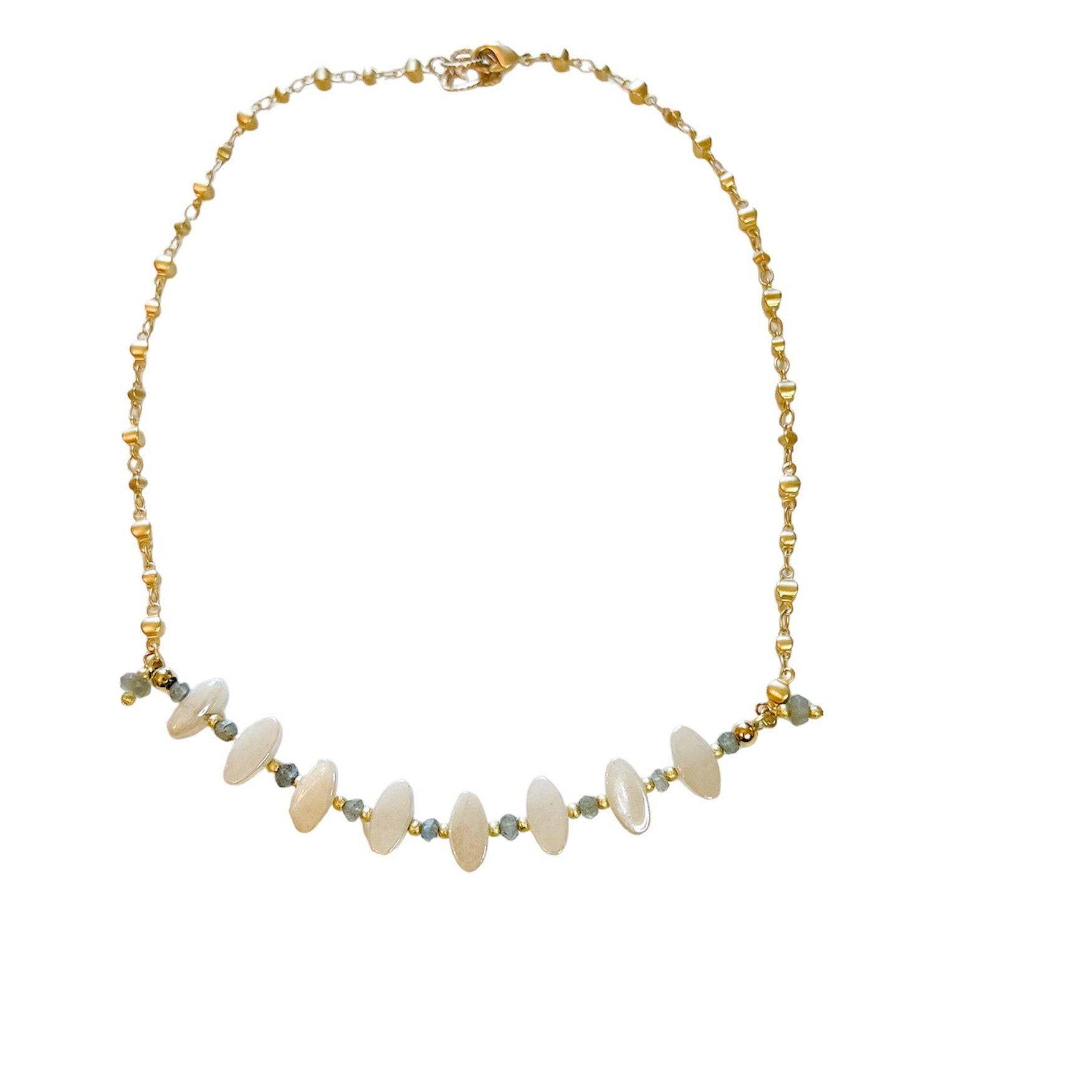 16" textured gold chain. Its unique design consists of cloud white oval charms beautifully complemented with a sparkling aqua stone situated between the ovals.