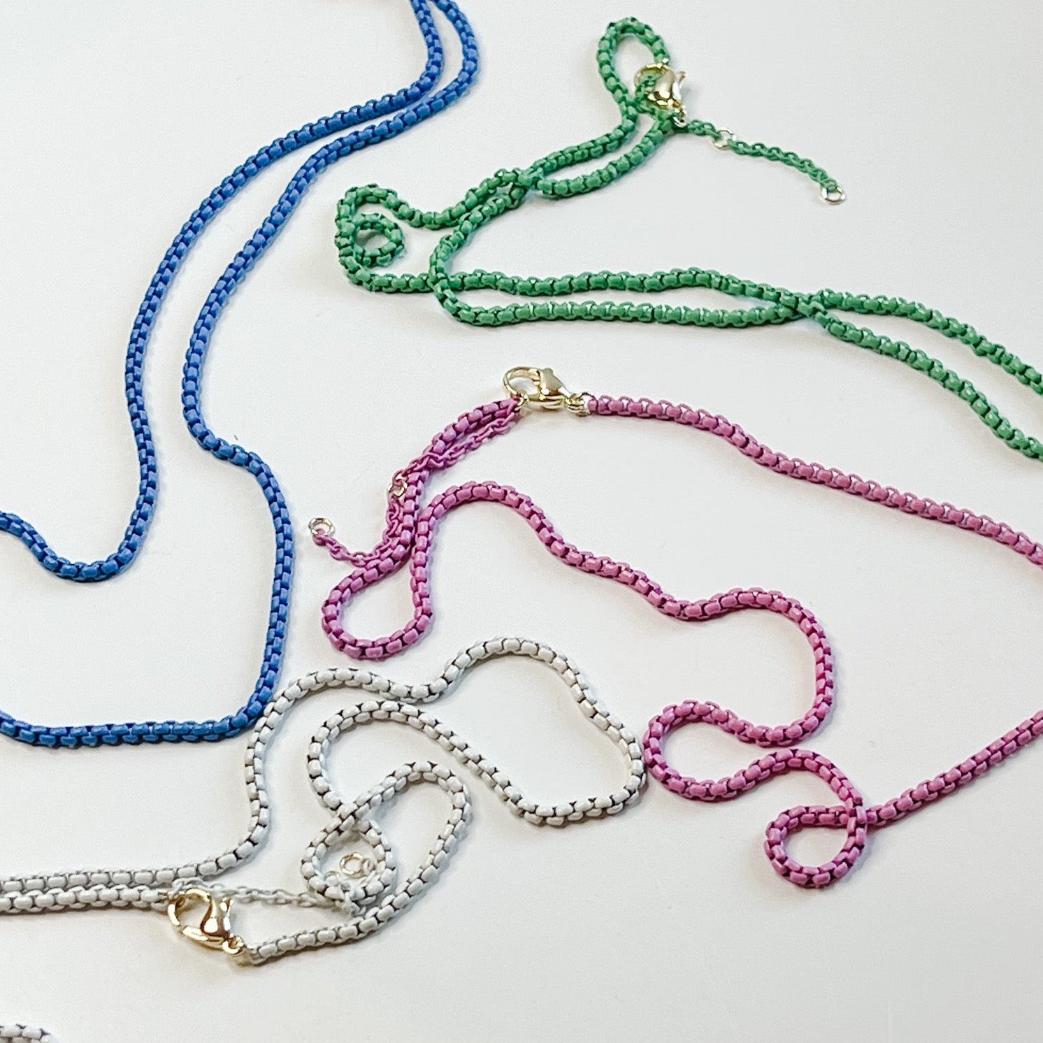  a unique colorful chain.   Available in Four Colors: Blue, Green, White, and Pink, 16"