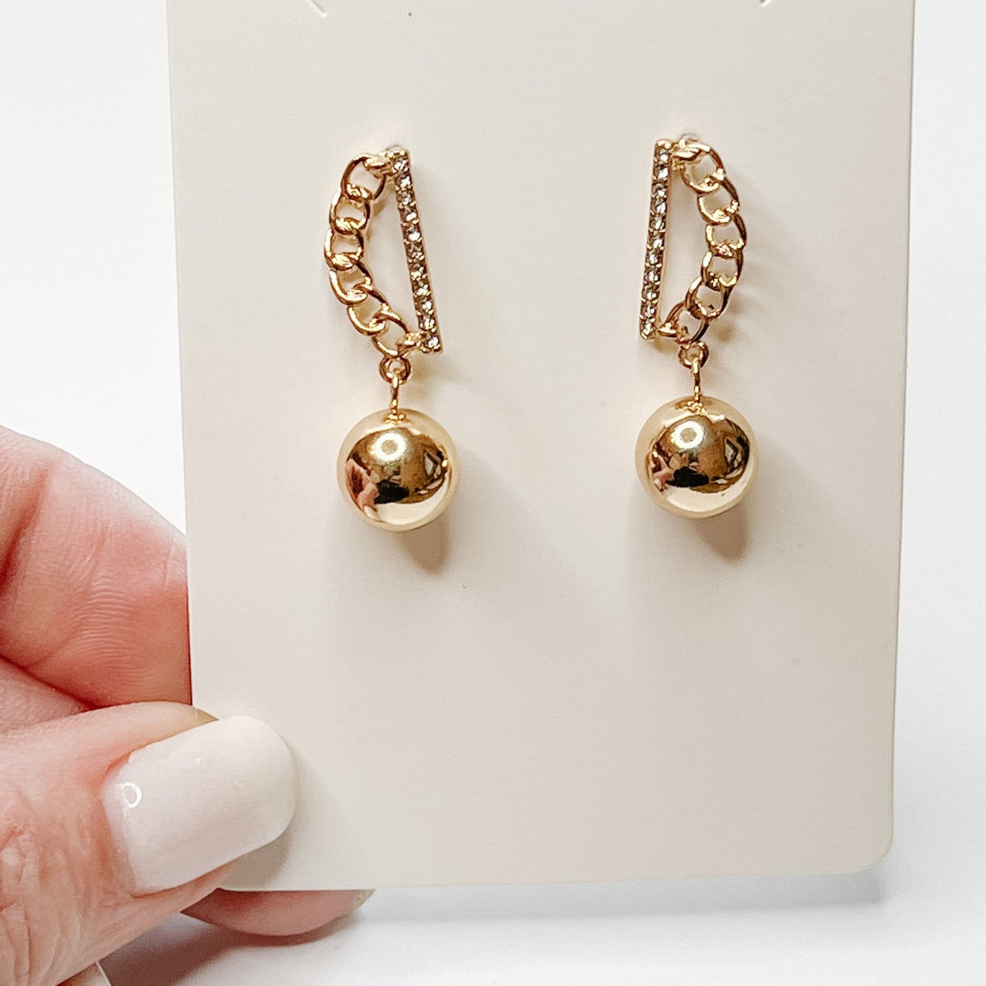 gold chain link and ball charm dangle earrings. 