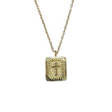 A gold-dipped necklace with a square pendant featuring a cross design.