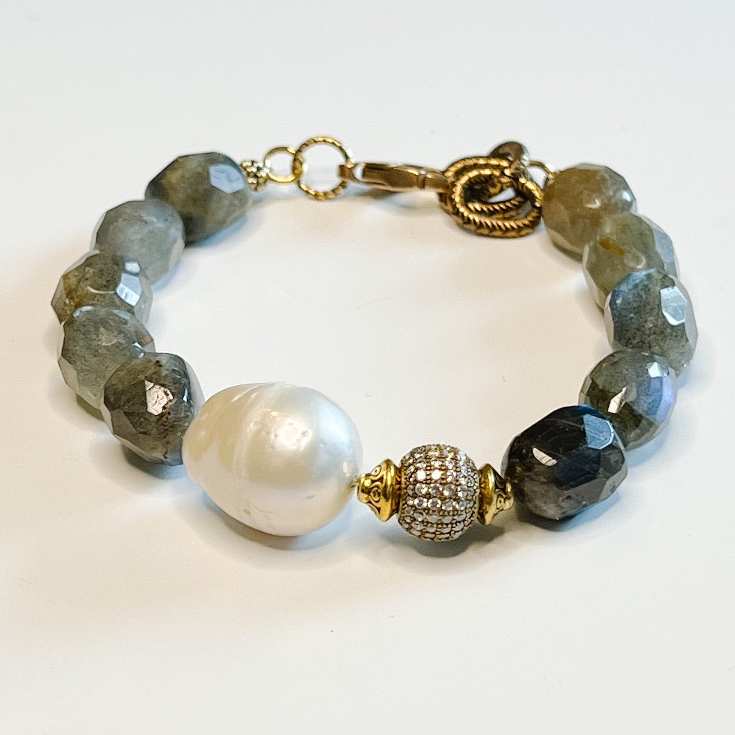 Bracelet, Ida - Danshire Market and Design, beaded bracelet, gold accents, gray beads, pearl stone and an embellished ball.