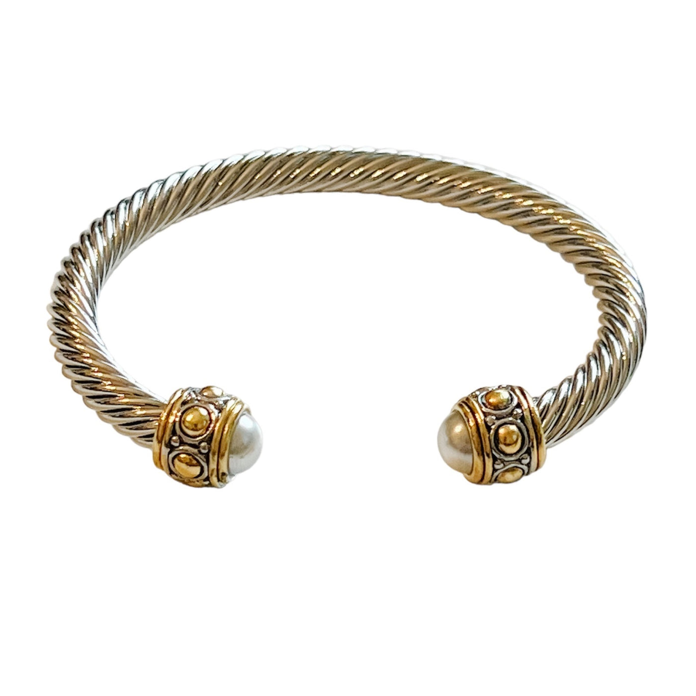 twisted silver open cuff bracelet with gold and ivory accents at opening
