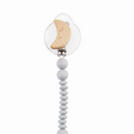 Wood pacy clip features silicone bauble strap with nylon loop cord, wooden moon