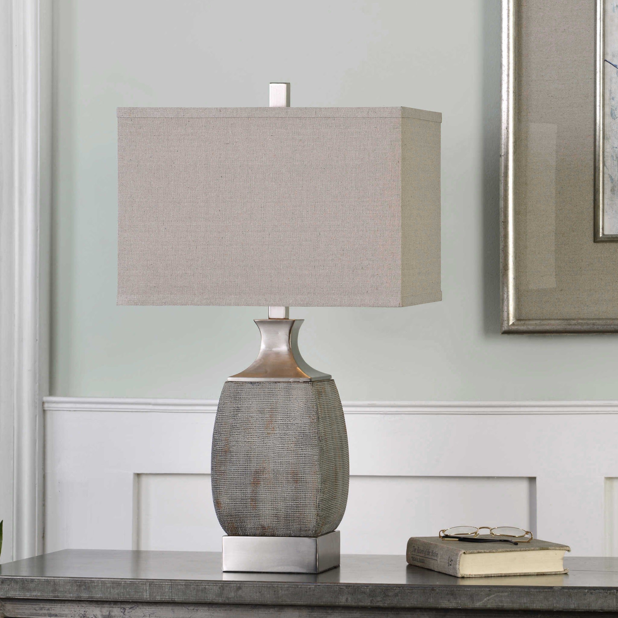 Lamp, Caffaro - Danshire Market and Design , Heavily textured rust bronze ceramic accented with brushed nickel plated metal details. The rectangle hardback drum shade is a light beige linen fabric. 28"